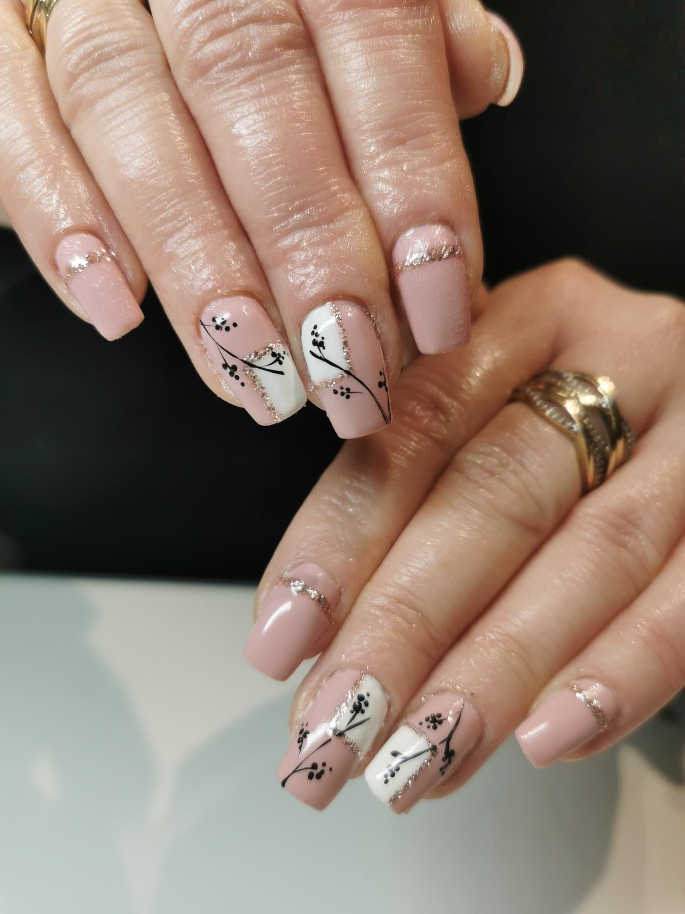 Nude nails with hand-painted floral nail art
